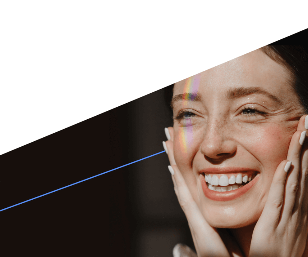 A woman holding her cheeks while smiling